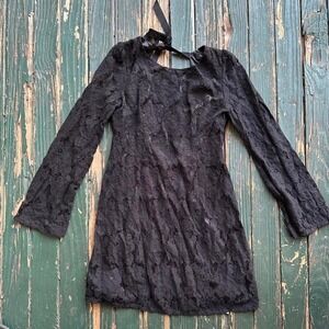 Black lace mini dress with long sleeves and a bow